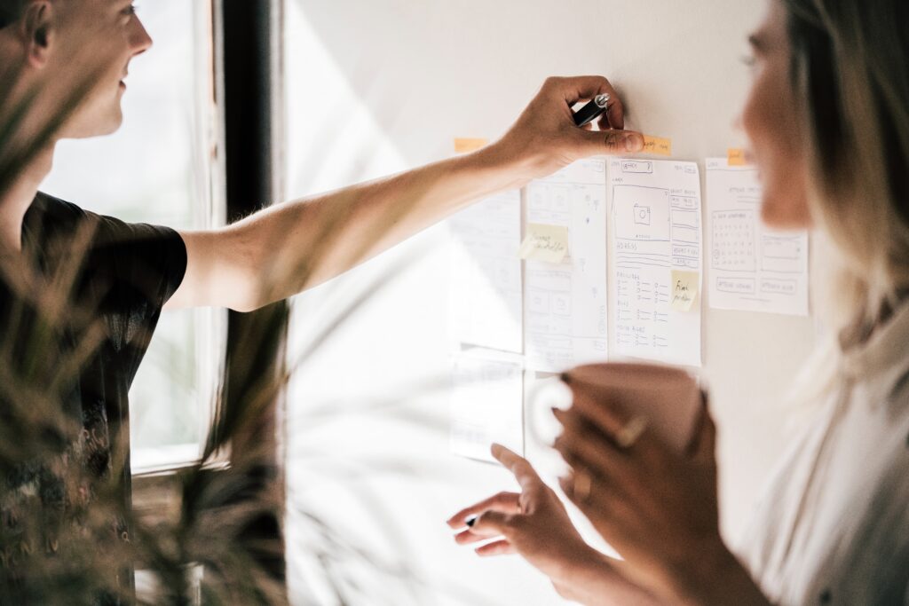 Photo of people working on a whiteboard